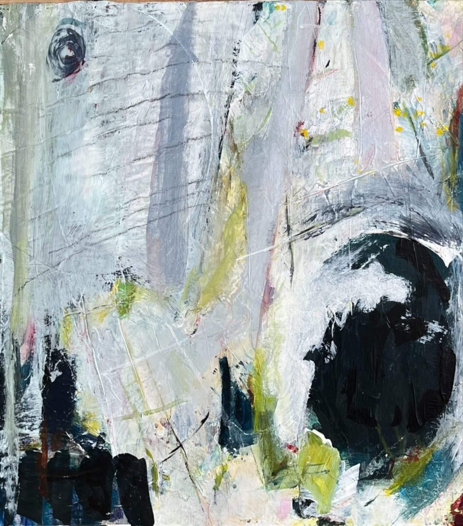 A painting of an elephant with white and black paint.